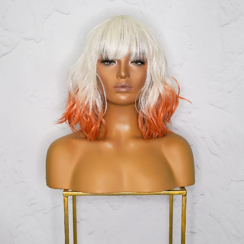 Bob wig with a wavy texture for a beachy lookJORDAN Ombre Orange Bob Fringe Wig