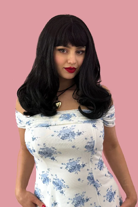 Bob wig with auburn highlights for a warm and vibrant appearanceLong black wavy bob (LOB) wig with straight retro fringe: Ciarra Bob wig with auburn highlights for a warm and vibrant appearanceLong black wavy bob (LOB) wig with straight retro fringe: Ciarra