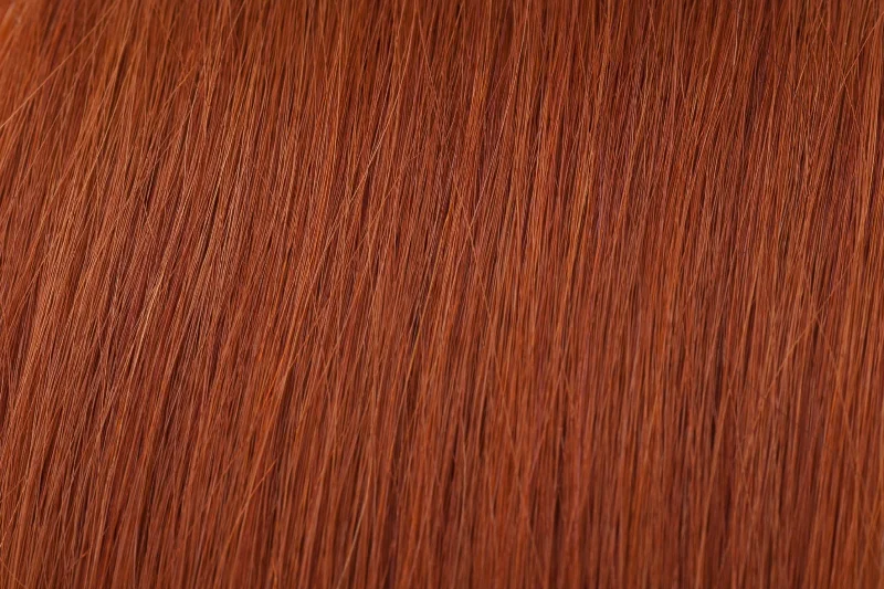 Clip - in hair extensions with a side - part for a more flattering lookSeamless Clip-In Extension: Copper Clip - in hair extensions with a side - part for a more flattering lookSeamless Clip-In Extension: Copper