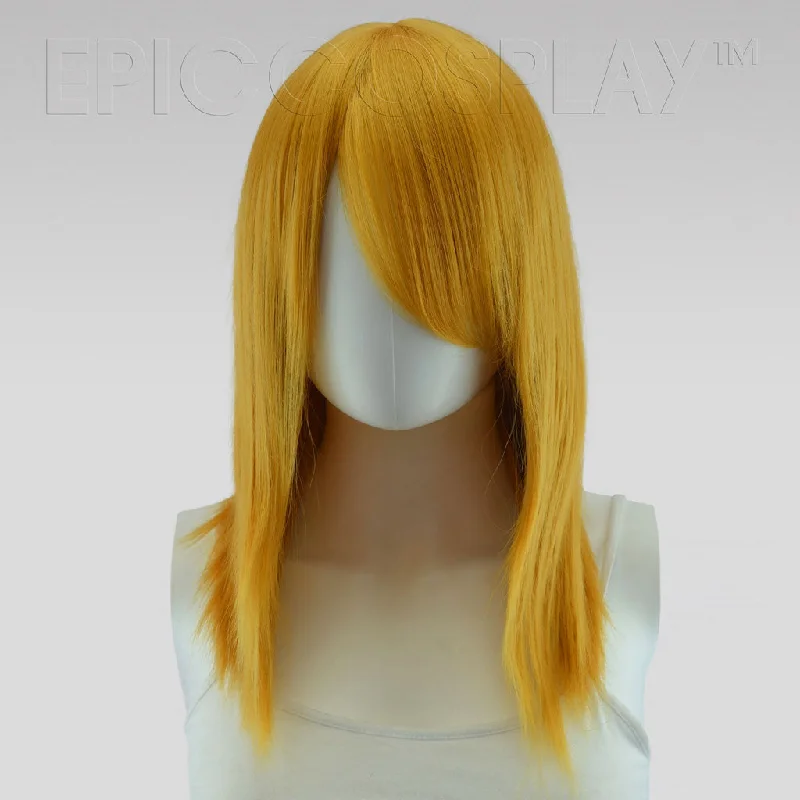 Medium - length wig with a curly fringe for a playful and youthful vibeTheia - Autumn Gold Wig Medium - length wig with a curly fringe for a playful and youthful vibeTheia - Autumn Gold Wig